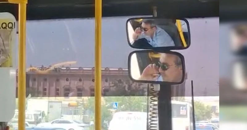 Marşrut sürücüsü sükan arxasında siqaret çəkdi Qalmaqal düşdü (VİDE)