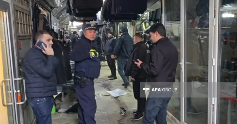 Qızıl mağazasında atışma: azərbaycanlı ata və oğlu yaralandı