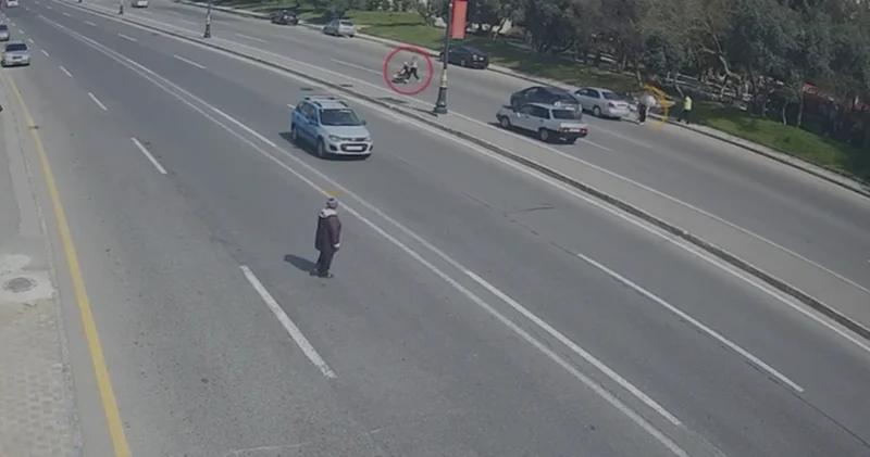 Piyada keçidindən istifadə etməyən valideynin övladı ilə birgə düşdüyü ağır qəzanın ANBAAN GÖRÜNTÜSÜ