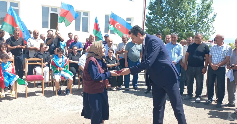 Переселенцы вернулись на родные земли и получили жилье фото
