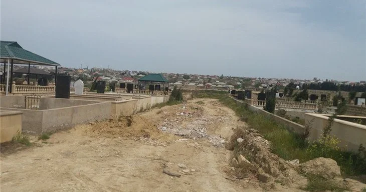 Gəlini tərəfindən öldürülən qadının meyiti çıxarıldı