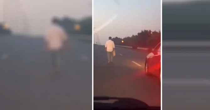 Magistral yolda ayaqyalın hərəkət edən kişi TƏHLÜKƏ YARATDI