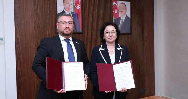 AzMİU və KNUBA arasında memorandum imzalanıb FOTOLAR