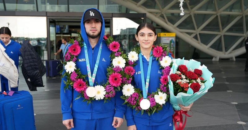 Taekvondo üzrə uğurla təmsil edən milli komandamızın üzvləri Vətənə dönüb FOTOLAR