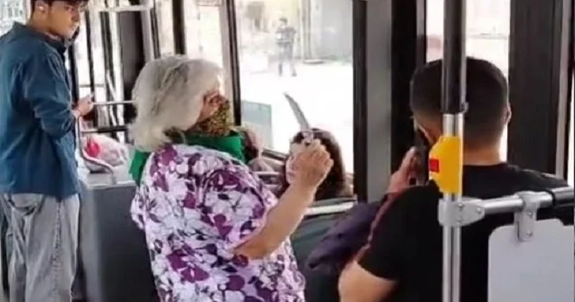 Əlibıçaqlı qadın avtobusda təşviş yaratdı Video