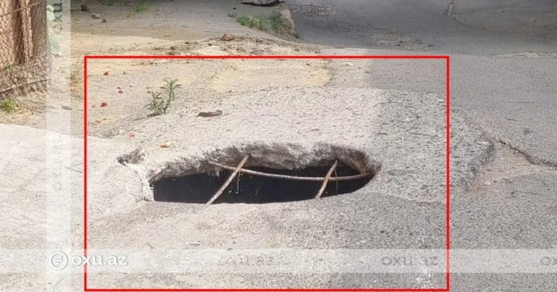 Yaşayış məntəqəsində təhlükəli vəziyyət: Yolun ortasında dərin çuxur var