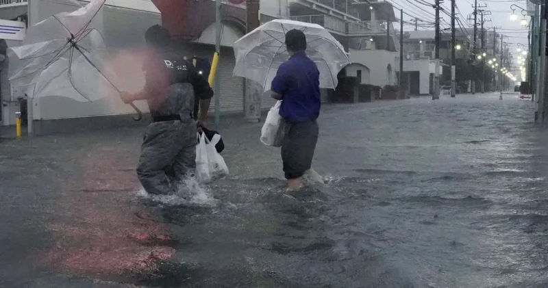 Yaponiyanı güclü tayfun bürüdü Foto video
