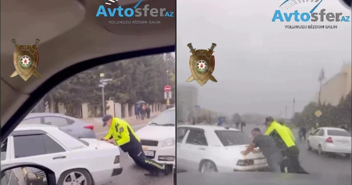 Maşın yolun ortasında xarab oldu: Polis kənara itələməkdə sürücüyə kömək etdi VİDEO