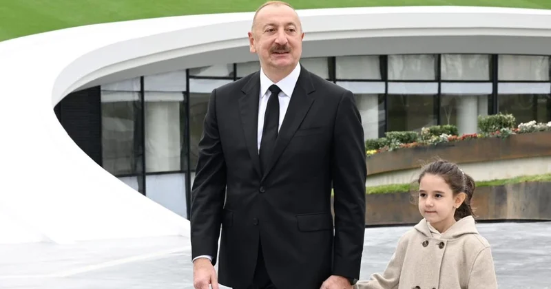 Что за девочку держал за руку Ильхам Алиев? фото