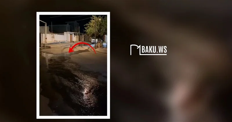 В бакинском поселке две недели вода течет по улицам ВИДЕО
