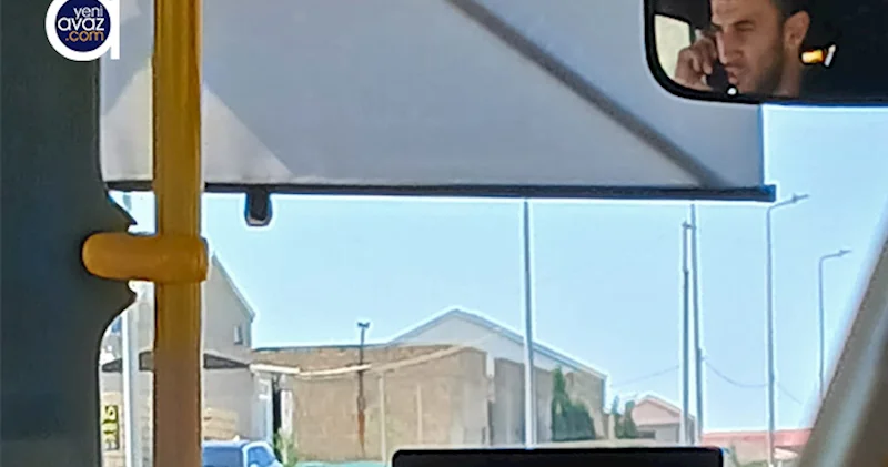 Avtobus sürücüsü sükan arxasında telefonla danışıb Video