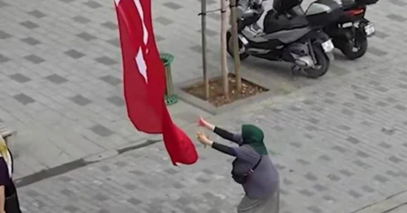 Yerə düşən bayrağı göydə tutan qadına pul verdilər FOTO